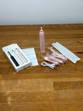 X-3 Sonic Electric Toothbrush in light pink with 4 toothbrush heads. New